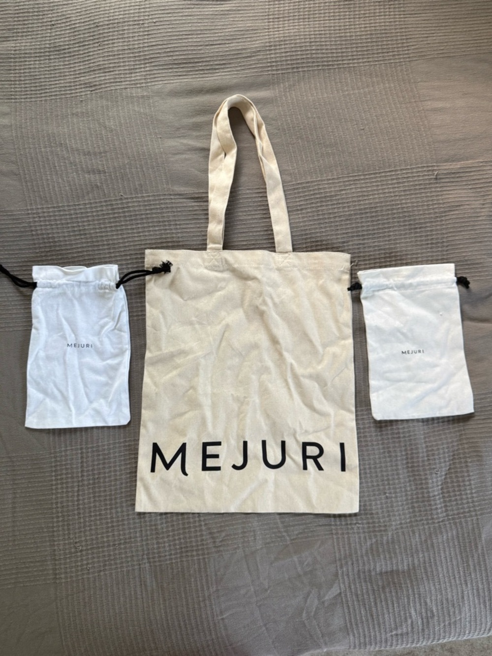 Mejuri Natural Canvas Tote with Black Logo and two Matching Pouches